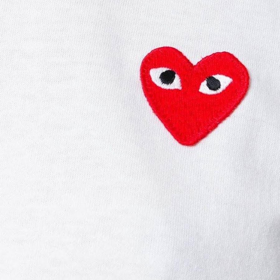 Comme des garcons лого