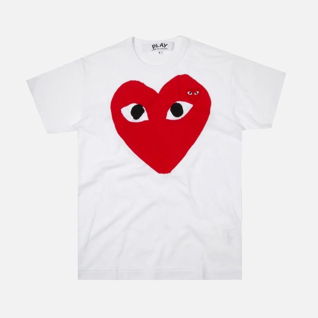 Comme des garcons лого